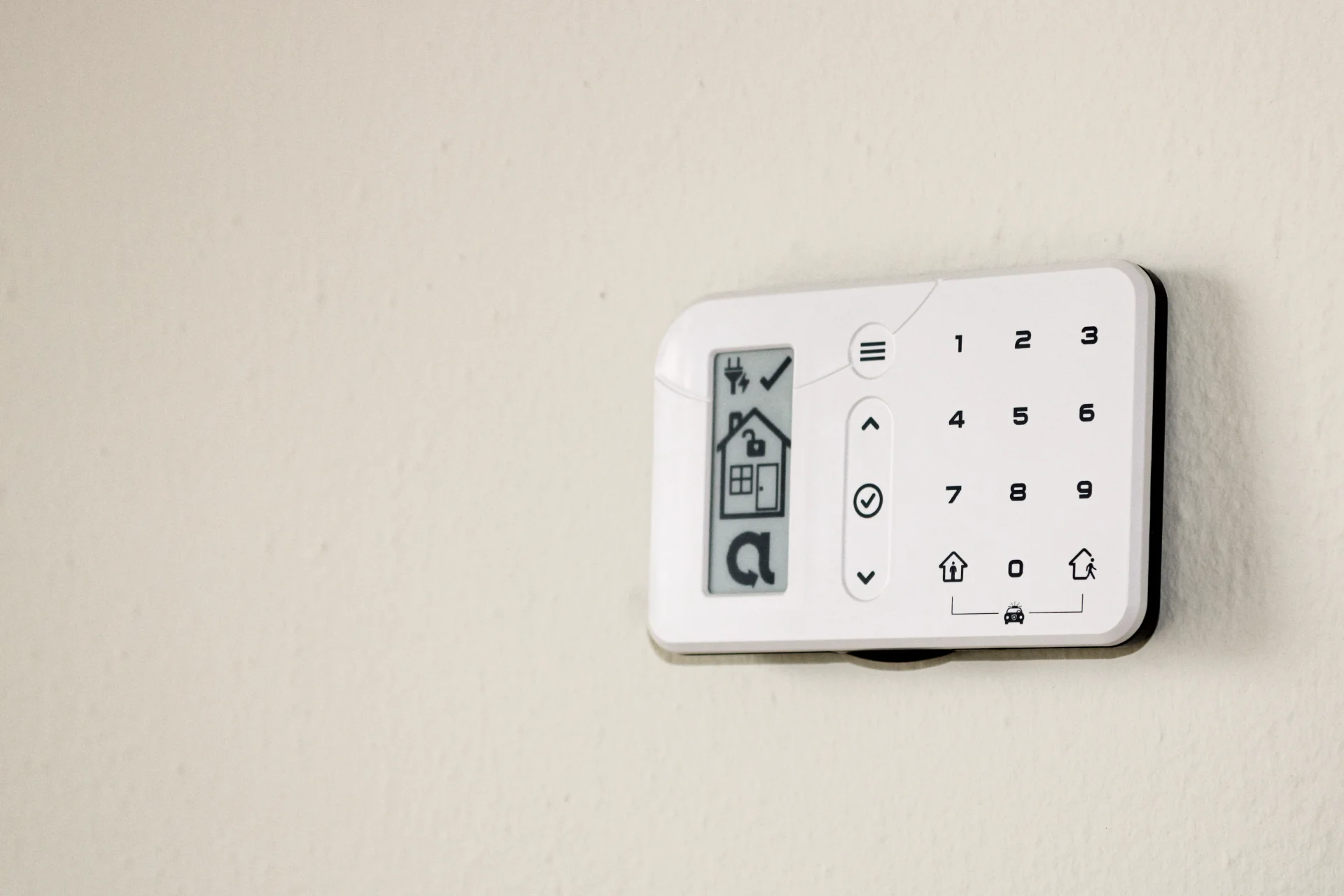 Pulsar alarm keypad panel mounted on wall